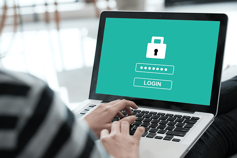 Person on computer typing password